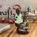 eCraftIndia Karate Style Monk Buddha Decorative Showpiece with 10 Free Smoke Backflow Scented Cone Incenses...