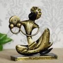 eCraftIndia Tribal Man with Pagdhi Playing Musical Instrument Decorative Showpiece, Golden and Black, one Size (IRLADY511)...