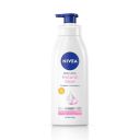 NIVEA Body Lotion Natural Glow, Cell Repair with UVA/UVB filters and SPF 15 | 400 ml...