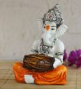 Orange Polyresin Lord Ganesha Playing Dholak Idol...